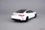 BMW M4 (2020) biele, 1:18 Minichamps